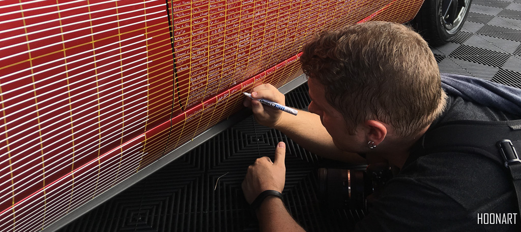 Bryce Womeldurf signing the millionth Miata